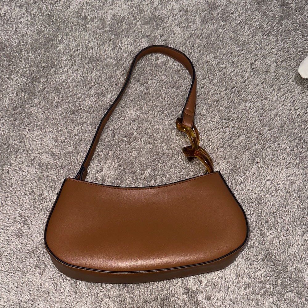 Elegant Brown Shoulder Bag with Tortoise Strap Detail